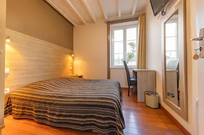 Un ou plusieurs lits dans un hébergement de l'établissement Auberge le John Steele