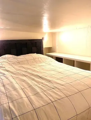 Un ou plusieurs lits dans un hébergement de l'établissement Magnolia Home
