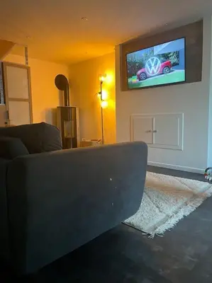 Télévision ou salle de divertissement dans l'établissement Maison à Luc sur Mer