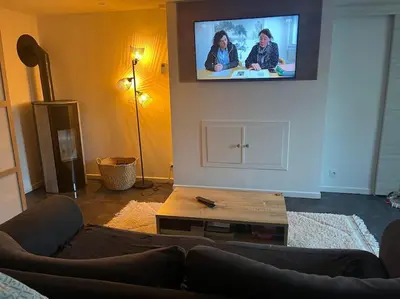 Télévision ou salle de divertissement dans l'établissement Maison à Luc sur Mer