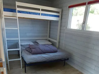 Un ou plusieurs lits dans un hébergement de l'établissement chalet de 1 a 7 personnes