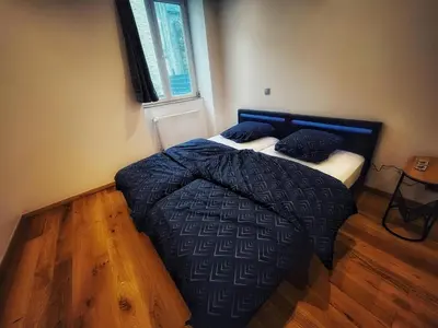 Un ou plusieurs lits dans un hébergement de l'établissement Grande maison moderne 5 chambres