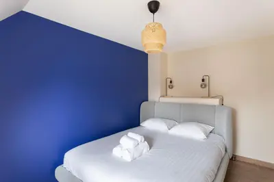 Un ou plusieurs lits dans un hébergement de l'établissement Chez Lisette - Maison climatisée dans Cancale