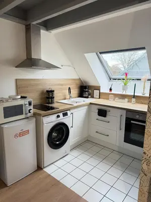 Cuisine ou kitchenette dans l'établissement L'escale du Mont