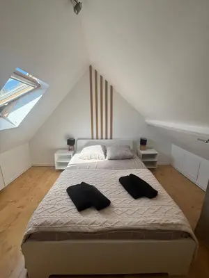 Un ou plusieurs lits dans un hébergement de l'établissement Cosy Duplex séjour duo ou petite famille Situation centrale - proche plage & commerces - Wifi et linge inclus