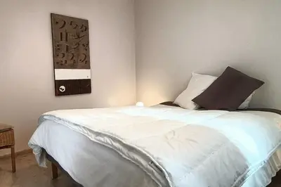 Un ou plusieurs lits dans un hébergement de l'établissement Le petit chalet bleu
