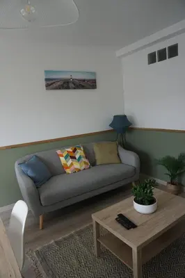 Coin salon dans l'établissement Appartement confortable