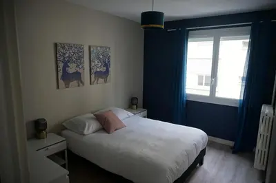 Un ou plusieurs lits dans un hébergement de l'établissement Appartement confortable