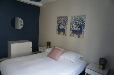 Un ou plusieurs lits dans un hébergement de l'établissement Appartement confortable
