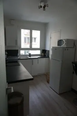 Cuisine ou kitchenette dans l'établissement Appartement confortable