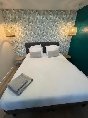 Un ou plusieurs lits dans un hébergement de l'établissement Le 89 Appartement au calme au centre de Cherbourg