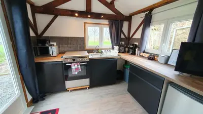 Cuisine ou kitchenette dans l'établissement Gite Petite