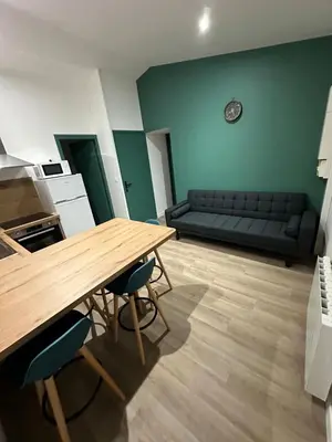 Coin salon dans l'établissement Appartement Granville 5