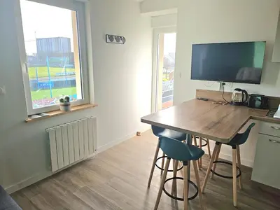 Télévision ou salle de divertissement dans l'établissement Appartement Granville 5