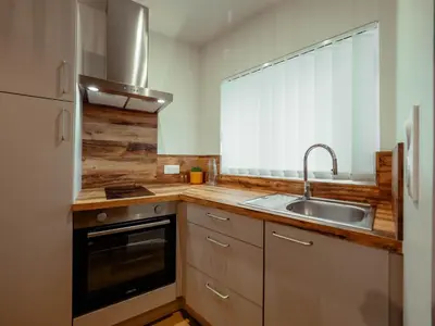 Cuisine ou kitchenette dans l'établissement Appartement Cosy Cœur de la Normandie