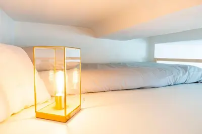 Un ou plusieurs lits dans un hébergement de l'établissement Petit appartement pour 2 à 3 personnes