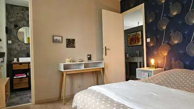 Un ou plusieurs lits dans un hébergement de l'établissement Bienvenue chez Didier et Domi