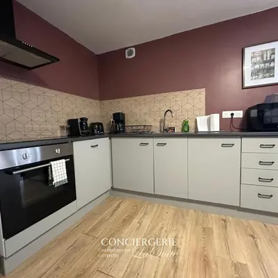 Cuisine ou kitchenette dans l'établissement Évasion à Hainneville