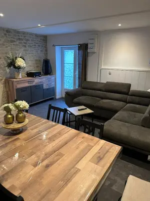 Coin salon dans l'établissement Le refuge de l hortensia gite