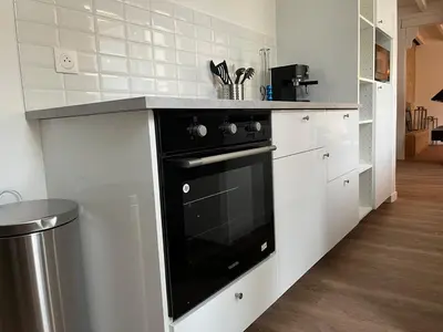 Cuisine ou kitchenette dans l'établissement La Perle Cachée