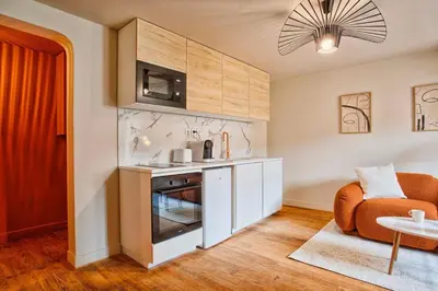 Cuisine ou kitchenette dans l'établissement Logement Cozy décoré avec gout