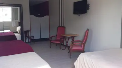 Un ou plusieurs lits dans un hébergement de l'établissement Hotel Moderne