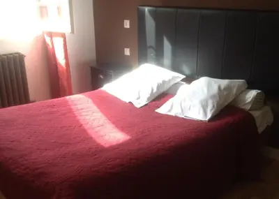Un ou plusieurs lits dans un hébergement de l'établissement Hotel Moderne