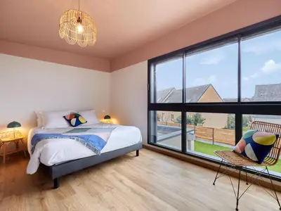 Un ou plusieurs lits dans un hébergement de l'établissement Holiday Home L'Aventure Gouvillaise by Interhome
