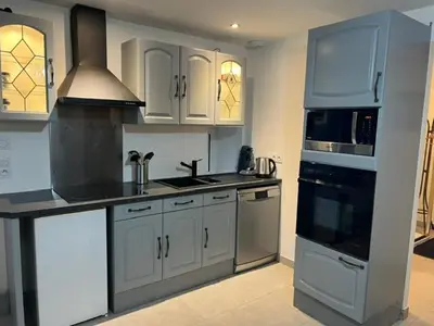 Cuisine ou kitchenette dans l'établissement Chez JP