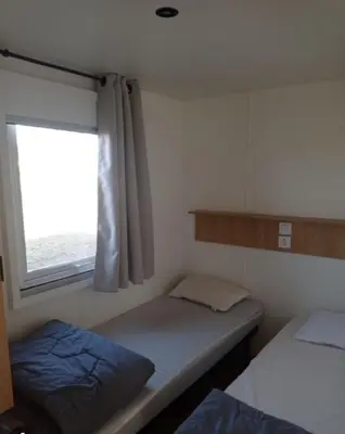 Un ou plusieurs lits dans un hébergement de l'établissement Mobil Home Calina 4-6 personnes