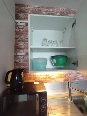 Cuisine ou kitchenette dans l'établissement Appartement vue sur mer & le port de Courseulles-sur-Mer