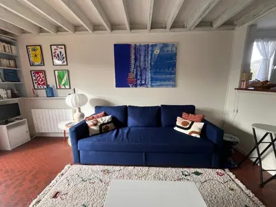 Coin salon dans l'établissement Cottage with Garden 5mn Beach