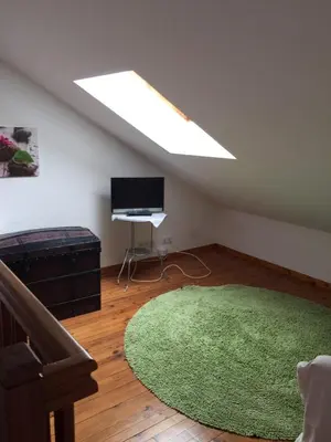 Télévision ou salle de divertissement dans l'établissement Les Ilous proche mer