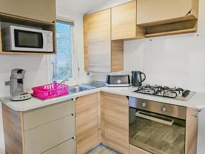 Cuisine ou kitchenette dans l'établissement Loc Jade