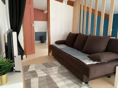 Coin salon dans l'établissement Appartement charmant face au haras