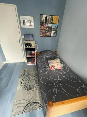 Un ou plusieurs lits dans un hébergement de l'établissement Appartement proche du centre - 58 m2