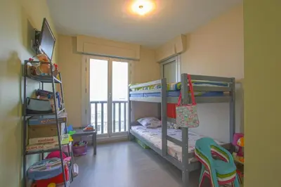 Un ou plusieurs lits dans un hébergement de l'établissement Appartement face à la mer