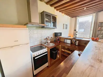 Cuisine ou kitchenette dans l'établissement A 10 minutes à pied de la gare et des Rives de l'Orne