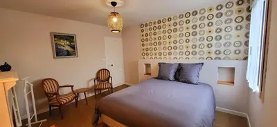 Un ou plusieurs lits dans un hébergement de l'établissement Le Cosy Home