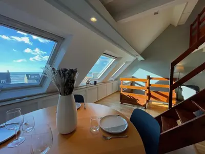 Coin salon dans l'établissement Appartement Ô Nid Perché Vue mer