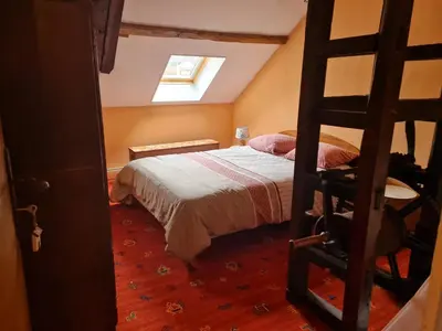 Un ou plusieurs lits dans un hébergement de l'établissement Gîte Ouillypontain