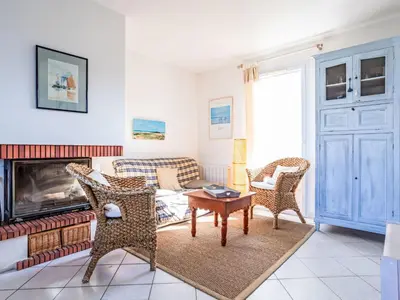 Coin salon dans l'établissement Holiday Home Les Goélands-29 by Interhome