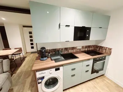 Cuisine ou kitchenette dans l'établissement Appartement Djo&Juh2