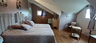 Un ou plusieurs lits dans un hébergement de l'établissement Le Pavillon de Chasse