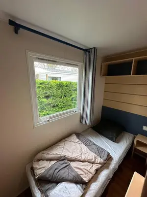 Un ou plusieurs lits dans un hébergement de l'établissement Mobil-home 5 personnes