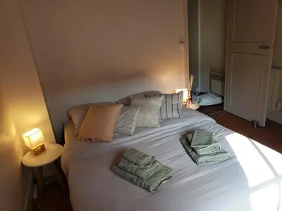 Un ou plusieurs lits dans un hébergement de l'établissement Maison de charme