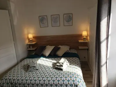 Un ou plusieurs lits dans un hébergement de l'établissement Maison de charme