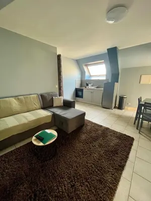 Coin salon dans l'établissement L'Agapanthe, avec accès piscine et jacuzzi