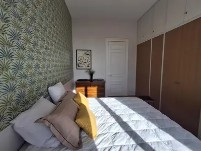 Un ou plusieurs lits dans un hébergement de l'établissement Séjour chic en Art Déco