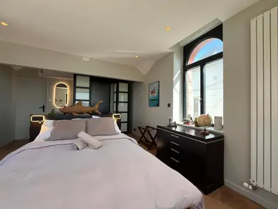 Un ou plusieurs lits dans un hébergement de l'établissement Les Tamaris - Grande Maison de Plage - Jacuzzi